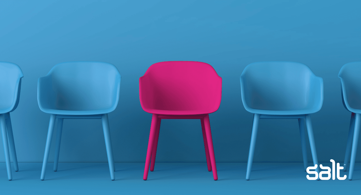 Recruiting in a candidate-led market is tricky - image of blue chairs with one pink chair